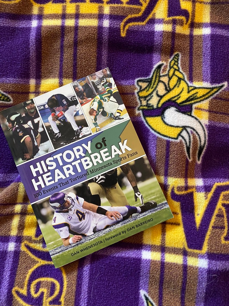 History of Hearbreak Minnesota Sports Fails book on a Minnesota Vikings blanket