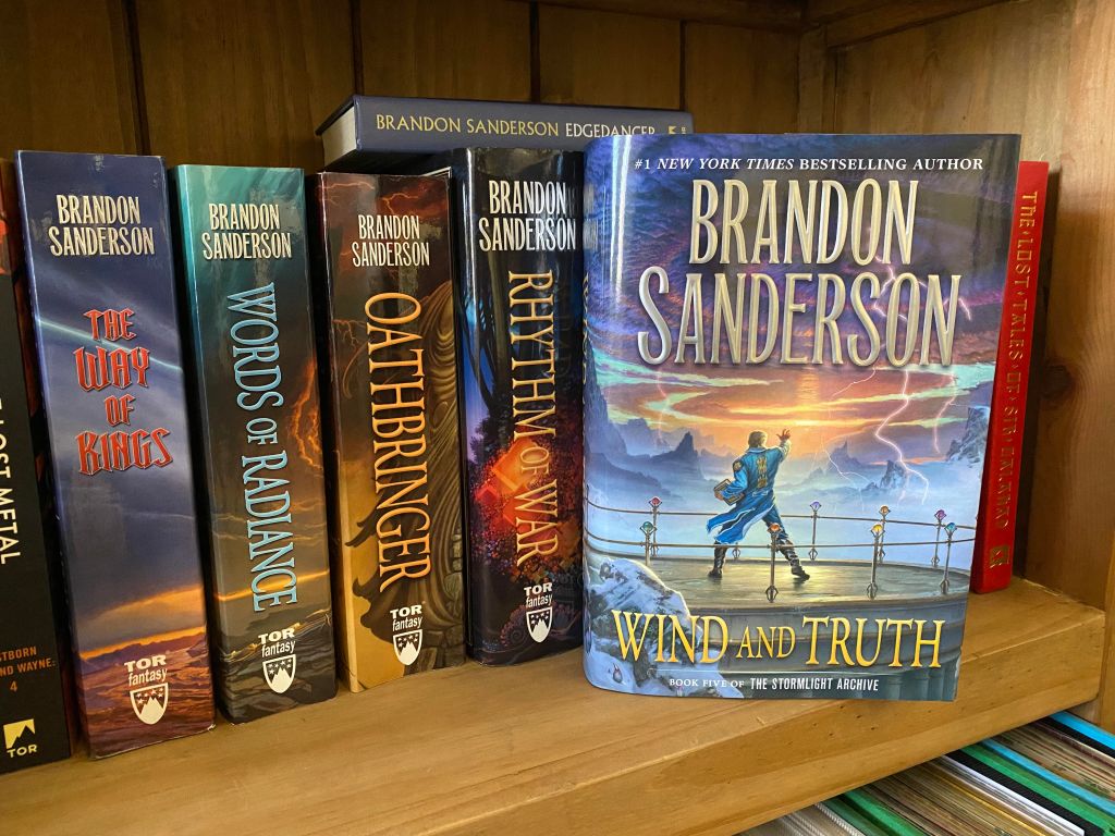 Brandon Sanderson's The Stormlight Archive series sitting on a bookshelf